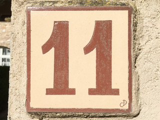 Ceramic tile with numer eleven 11