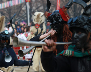 PERNIK, BULGARIA - JANUARY 29, 2017 - Masquerade festival Surva in Pernik, Bulgaria. People with mask called Kukeri dance and perform to scare the evil spirits