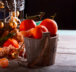 Mandarins in the basket. Metal cage