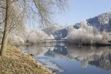 Fairytale snowy winter countryside with blue Sky in Bohemia, Czech Republic