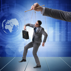 Businessman puppet being manipulated by boss