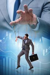 Businessman puppet being manipulated by boss