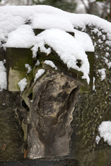 Snowy Jesus on the mystery old Prague Cemetery, Czech Republic