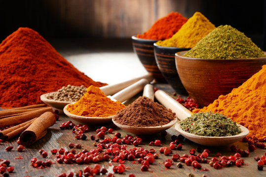 Fototapeta Variety of spices on kitchen table