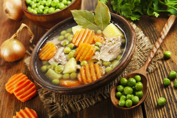 Soup with green peas and meat