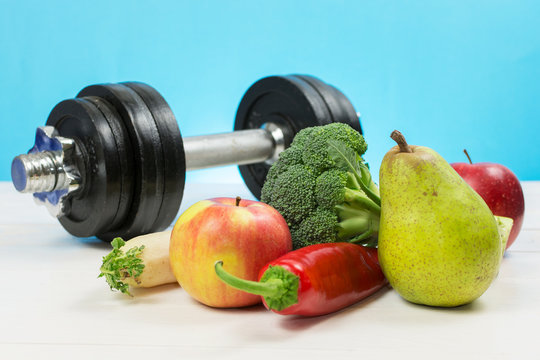 Healthy lifestyle concept. Eat fruits and vegetables and workout