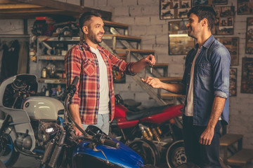 Guys at the motorbike repair shop