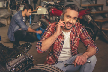 Guys at the motorbike repair shop