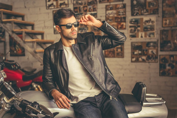 Handsome young biker - obrazy, fototapety, plakaty