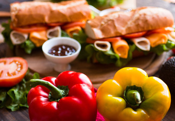 Delicious and Tasty sandwiches with turkey, ham, cheese, tomatoe