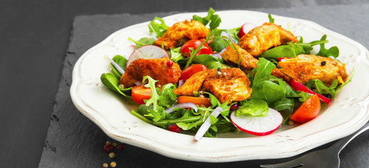 Chicken salad with rucola and baby spinach leaves salad, radish