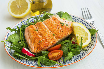 Grilled salmon with fresh vegetables salad