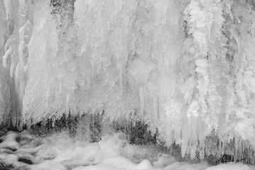 Frozen waterfall with ice in winter.