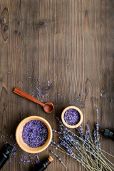 organic cosmetics with lavender on wooden background top view