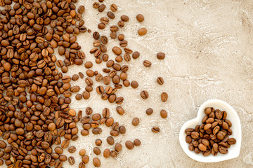coffee beans on gray table top view