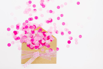Pink paper confetti fly out enoverta, holiday concept