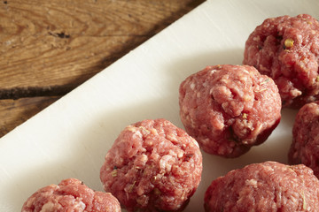 seasoned raw beef meatballs, ready for cooking