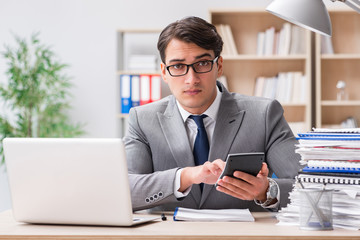 Fototapeta premium Handsome businessman working in the office