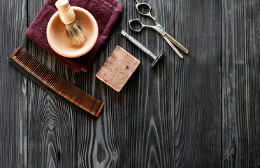 Tools for cutting beard barbershop top view on wooden background