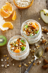 Delicious healthy American breakfast made of granola, yogurt and fruits. Classic US morning meal. Traditional healthy snack. Top view.