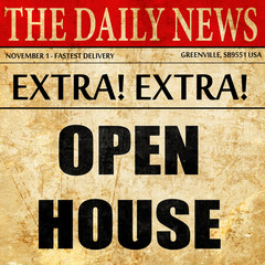 Open house sign, newspaper article text