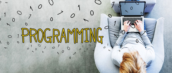 Programming text with man using a laptop