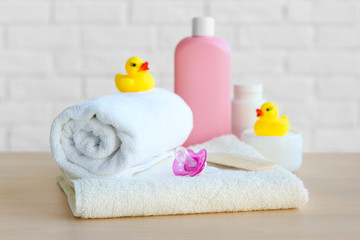 Set of baby accessories for hygiene on wooden table closeup