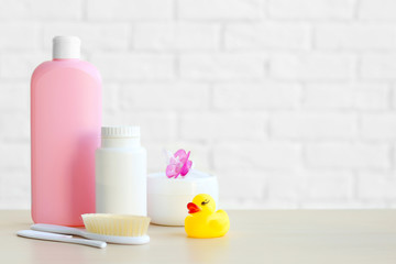 Set of baby accessories for hygiene on wooden table closeup