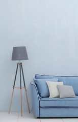 Modern couch and lamp on light wall background