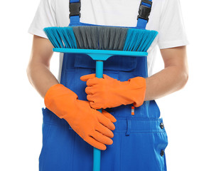 Close up view of young man with floor brush on white background