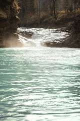 Mountain stream with waterfall in forest