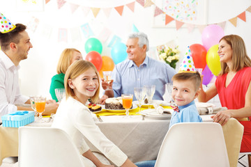 Family celebrating birthday at home
