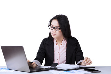 Beautiful Asian woman working on laptop