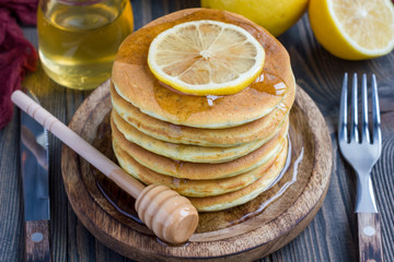 Healthy homemade lemon and chia seed pancakes served with honey, horizontal