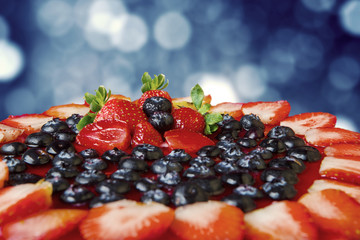 Delicious cake decorated with berries fruit