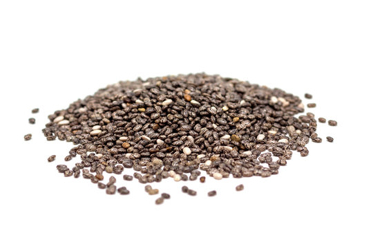 Heap of chia seeds isolated on white background, side view