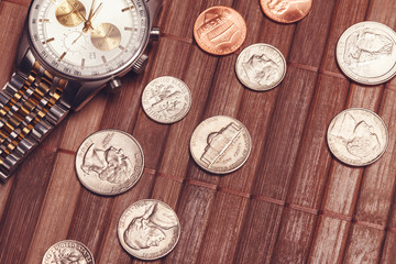 Luxury but not new watch with coins