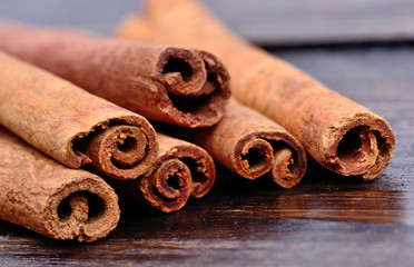 Group of cinnamon sticks on table
