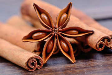 Anise star with heap of cinnamon sticks