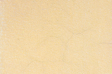 Fototapeta premium Closeup surface of old yellow cement wall textured background