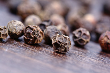 Many peppercorns on table
