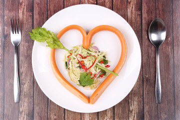 Sausage cheese in heart style with spicy green mango salad.