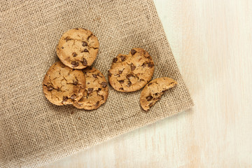 Chocolate chips cookie on burlap texture, with copyspace