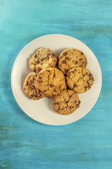 Plate of chocolate chips cookies with place for text