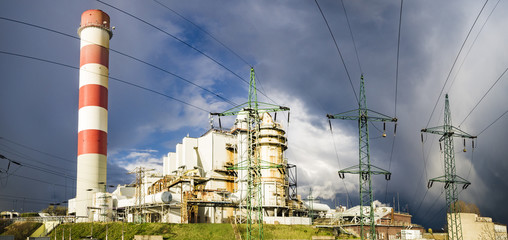 power plant in Szczecin against passing menacing storm cloud