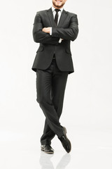 successful businessman in a stylish black business suit on white