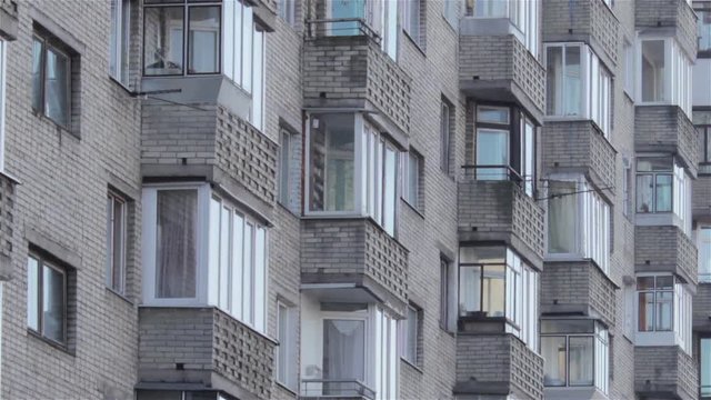 apartment building/building of white bricks in city