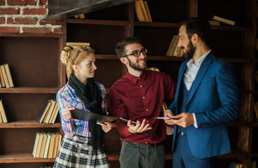 business team with documents discussing the current problems in 