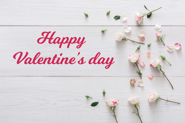 Valentine day background, petals and flowers on white wood