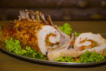 A hefty piece of meat stuffed with vegetables.
